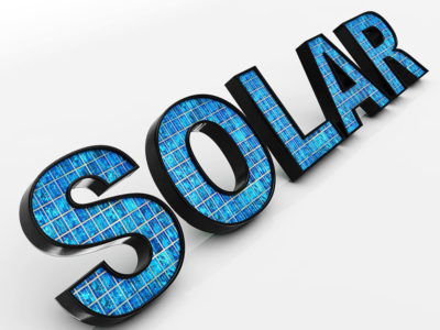 The word solar with small solar panels inside each letter